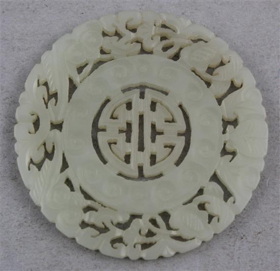 A Chinese pale celadon jade disc, 19th century, 5.5cm.